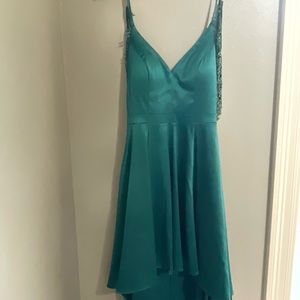 Size 5. Green beautiful Sequin Hearts dress. Wore once to homecoming.